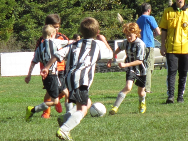 Young Son in action on the soccer field
